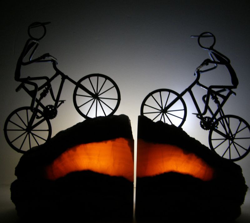 backlit bookends with bikes mounted on top