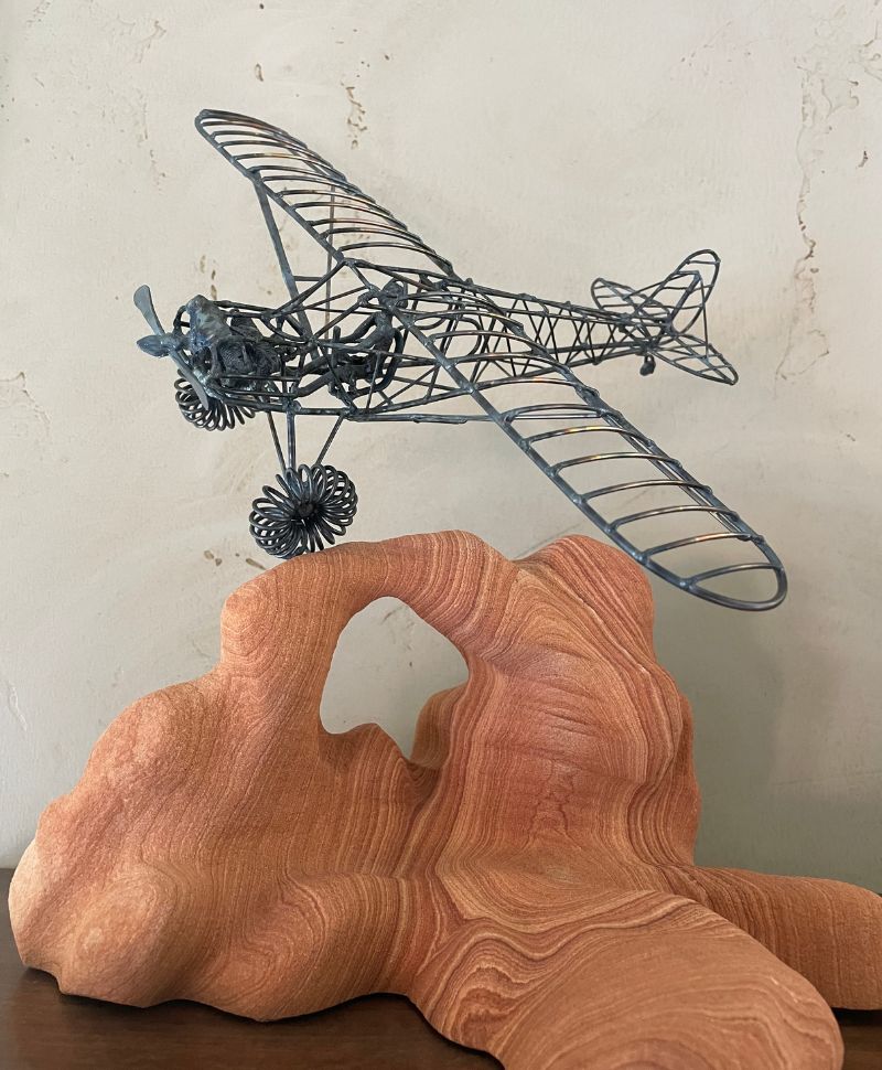 plane and arch sculpture